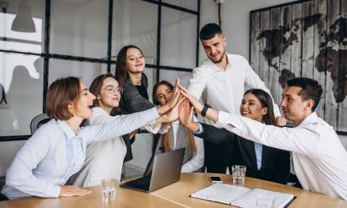 Group of people working out business plan in an office Group of people working out business plan in an office